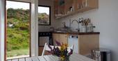 shipping container cabin interior fully equipped kitchen cornwall