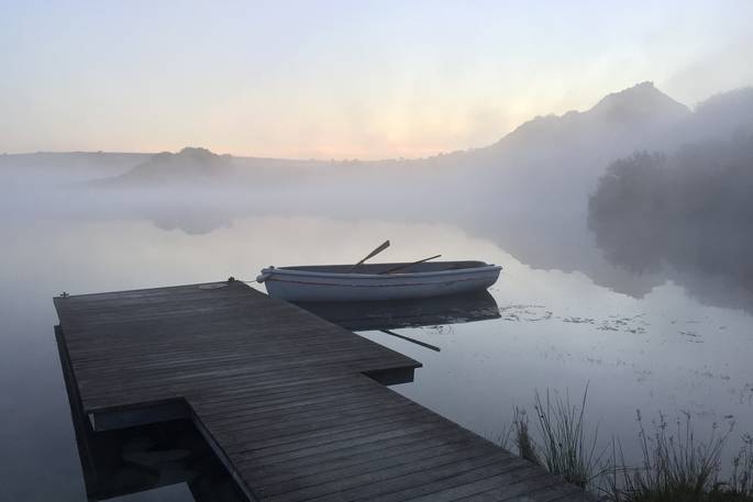 The Lake cabin, shipping container - misty morning with rowing boat, Bodmin moor, Cornwall. Cornish holiday