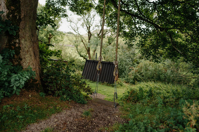Bowber Head Roundhouse cabin swing in the woods
