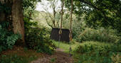 Bowber Head Roundhouse cabin swing in the woods
