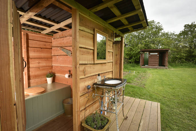 Communal compost toilets at Drybeck Farm in Cumbria