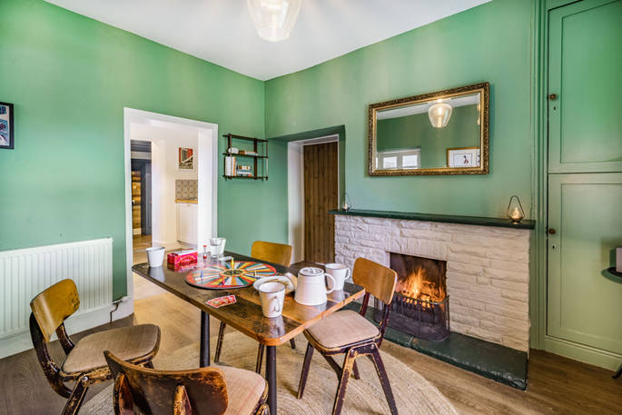 Cuckoo Cottage dining with fire place, Edenhall Estate, Penrith, Cumbria