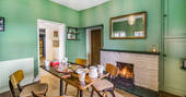 Cuckoo Cottage dining with fire place, Edenhall Estate, Penrith, Cumbria
