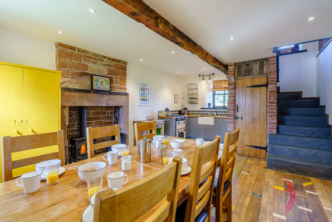 High Barn - kitchen with wood burner, Edenhall Estate, Penrith, Cumbria