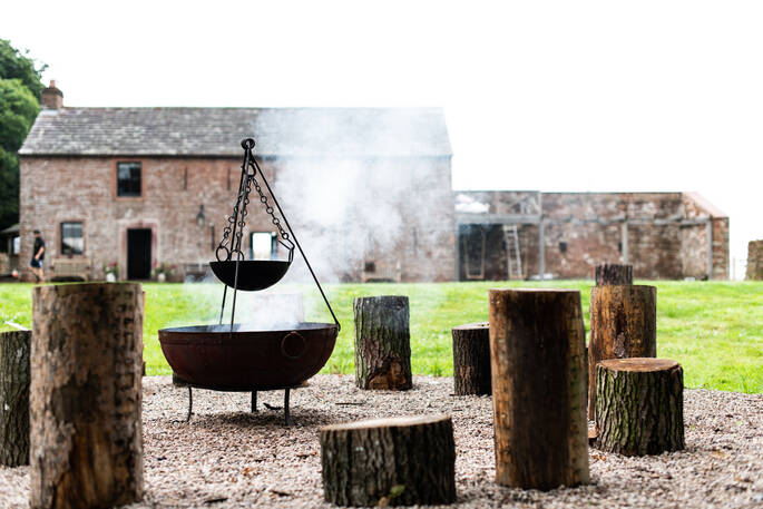 Sit around the fire pit at The Bothy at High Barn in Cumbria