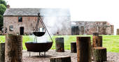 Sit around the fire pit at The Bothy at High Barn in Cumbria
