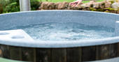 The wood-fired hot tub at The Bothy at High Barn in Cumbria