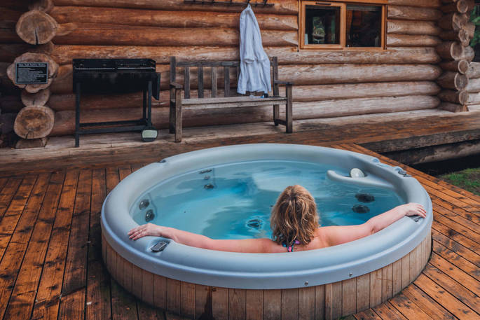 Relax in the hot tub at The Lodge at Edenhall, Cumbria
