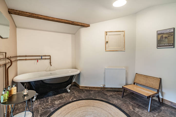 West Lodge house bathroom with bath tub, Edenhall Estate, Penrith, Cumbria