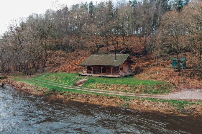 View of The Lodge at Edenhall from across the river
