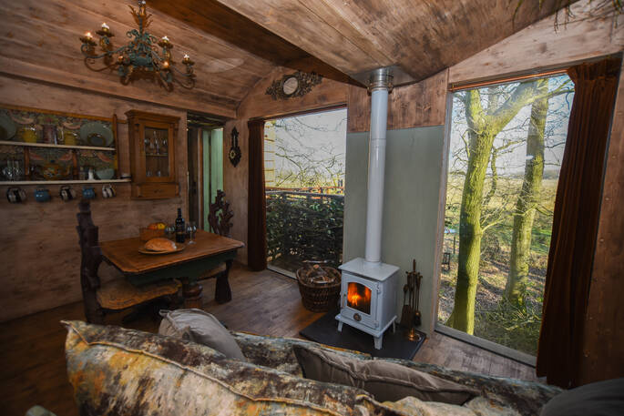 Light the wood-burner and relax inside Faraway Treehouse in Cumbria 