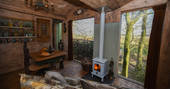 Light the wood-burner and relax inside Faraway Treehouse in Cumbria 