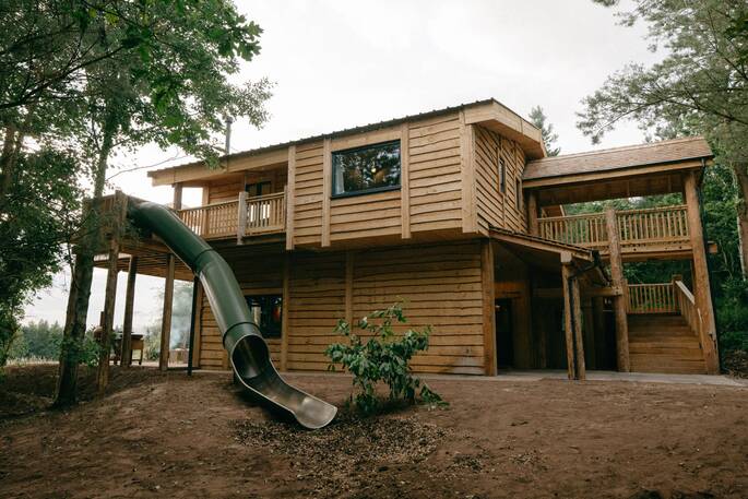 Luna treehouse exterior showing slide
