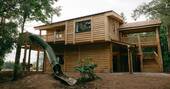 Luna treehouse exterior showing slide