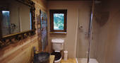 The beautifully rustic bathroom at Netherby Treehouse in Cumbria