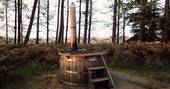 The wood-fired hot tub at Netherby Woodland Yurt in Cumbria