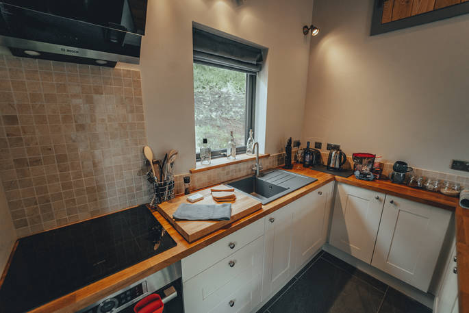 Edens Vale Lodge cabin kitchen, River House, Penrith, Cumbria