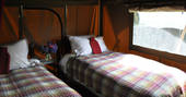 The Portland safari tent twin single beds bedroom, The Gathering, Hope Valley, Derbyshire