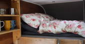 King-size bed on mezzanine level inside Martin Green at Trent Adventure 