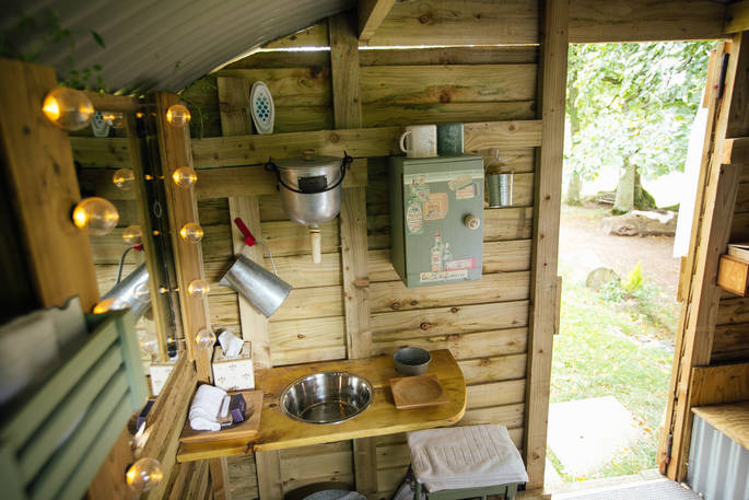 The beautifully rustic washroom at Fairfield shepherd's hut, Acorn Farm in Devon