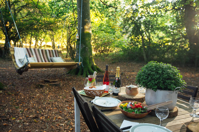 Dine al fresco on a sunny summer's evening at Acorn Farm in Devon