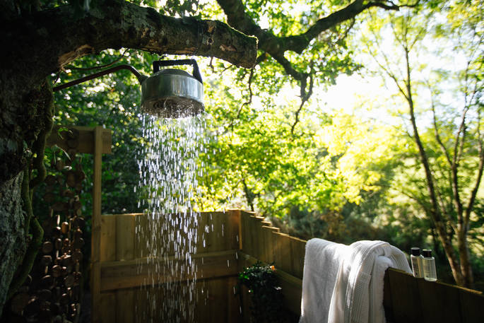 Shower amongst the trees at Turners Woodland Suite at Acorn Farm in Devon