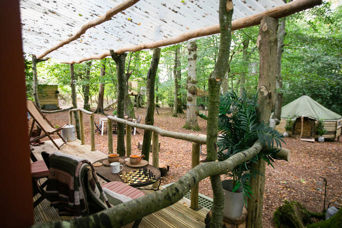 Sit back on the outdoor decking and enjoy a game of chess at Turners Woodland Suite in Acorn Farm