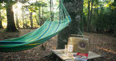 Turn on the retro style radio, lay on the hammock and relax at Turners Woodland Suite at Acorn Farm in Devon