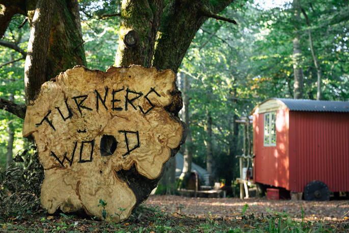 Wooden sign for Turners Wood at Acorn Farm