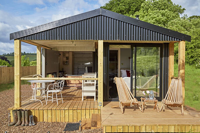 Let the breeze flow into Brownscombe Cabin in Devon, with views from the bed and copper bath tub