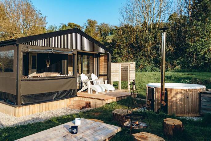 Let the breeze flow into Brownscombe Cabin in Devon, with views from the bed and copper bath tub
