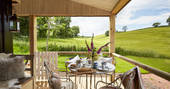 Rolling Devon countryside from Brownscombe Cabin and the outside deck. Pick up some fresh croissants from the onsite honesty shop