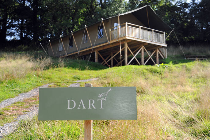  Brownscombe Luxury Glamping in Devon with Dart sign outside safari tent for six