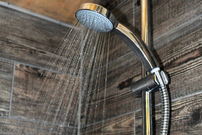 Hot shower in the bathroom of Dart safari tent