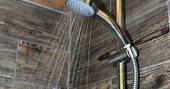 Hot shower in the bathroom of Dart safari tent