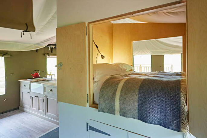 Cabin bed next to the kitchen suitable for children