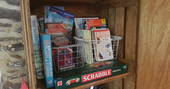 Guidebooks, games and local maps to borrow inside of The Linhay