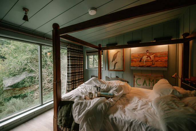 The bedroom with a four-poster bed