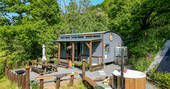 Carpenter Cabin exterior with hot tub and picnic table, Germansweek, Devon, England