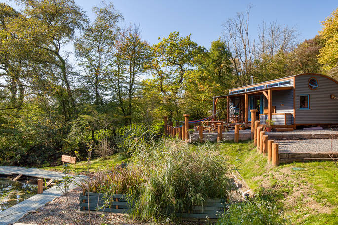 Outside the cosy and quirky Carpenter Cabin at Devon Dens