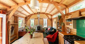 The Devon Den cabin interior with woodburner, Germansweek, Devon