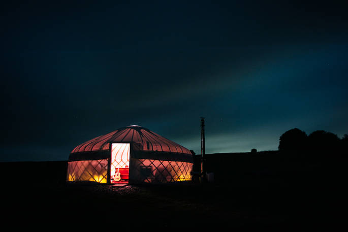 Devon Yurt glowing in the night time sky of Devon 