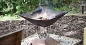Stoke up the fire pit at The Pheasant's Retreat in Devon
