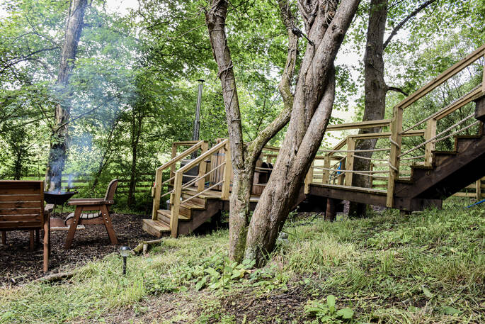 Take a wonder down the steps to the fire pit area at The Pheasant's Retreat in Devon