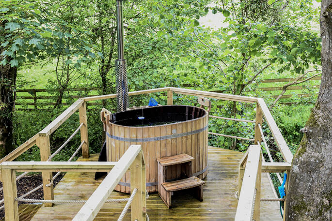 The wood-fired love tub on your own private raised decking at Pheasant's Retreat in Devon