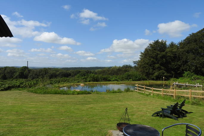 Elsie May shepherd's hut view to the pond, Torrington, Devon