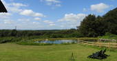 Elsie May shepherd's hut view to the pond, Torrington, Devon