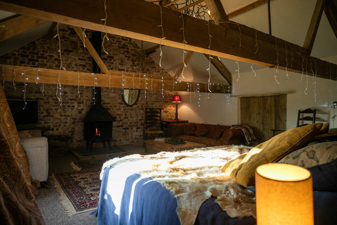 The cosy barn with a log burner to keep you toasty at Vintage Vardos in Devon