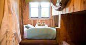Two single bunk beds for children inside Treetops Treehouse in Devon