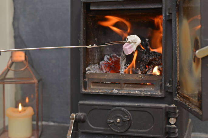 Toast marshmallows on the cosy wood burner at Gosling Lodge in Devon